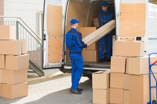 Furniture removal team handling a move in a Knightsbridge apartment building