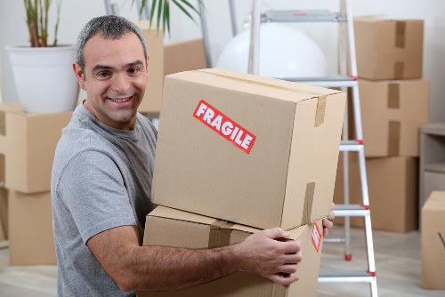 Local removal team loading furniture into a van in Knightsbridge
