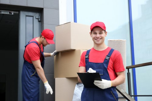 Moving team preparing furniture with protective care in Knightsbridge