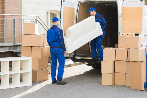 Packed office equipment ready for transport in a central London move