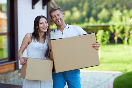 Professional movers handling furniture and boxes in central London